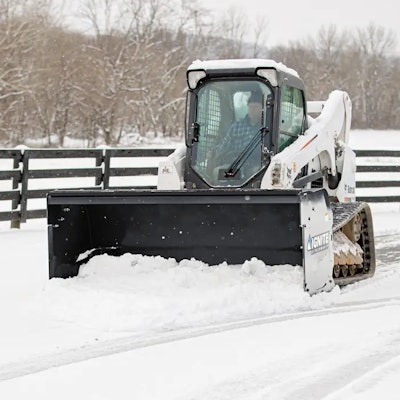 Ignite attachments snow pusher on white compact track loader pushing snow