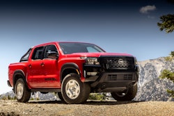 red 2024 Nissan Frontier 4x4 pickup on gravel hill top