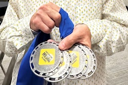 Senior Editor Ryan Whisner holds Equipment World's 2023 Construction Media Alliance Awards.