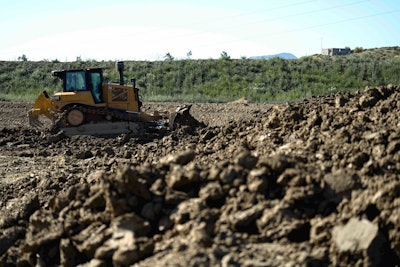 Cat D6XE dozer pushing dirt