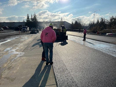 K&L Industries paver lays asphalt mat