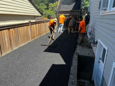 crew paves driveway in Seattle with asphalt made with Modern Hydrogen captured carbon