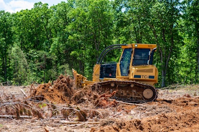 Tigercat TCi 920 dozer pushing tree debris