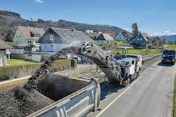 Wirtgen W150Fi cold planer shooting millings into back of truck