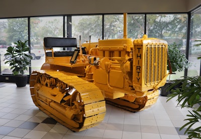 vintage Cat Thirty crawler tractor in showroom at Gregory Poole Equipment