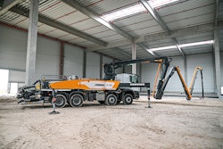 liebherr 31 xxt truck mounted concrete pump boom unfolded in metal building