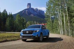 light blue 2024 Honda Ridgeline TrailSport mountains in background