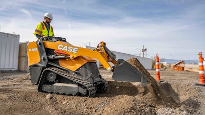 Case TL100 compact utility loader dumping dirt