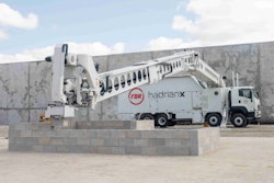 white FBR Hadrian X truck-mounted brick laying robot building masonry block wall