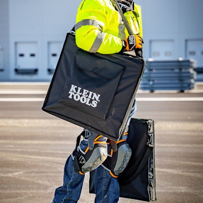 Man carrying Klein Tools Portable Solar Panel