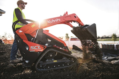 Kubota SCL1000 compact utility loader dumping earth