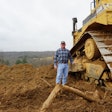 Gregg Lunsford next to his D8N Cat bulldozer