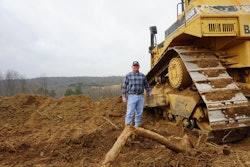 Gregg Lunsford next to his D8N Cat bulldozer