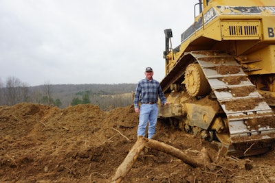 Gregg Lunsford next to his D8N Cat bulldozer