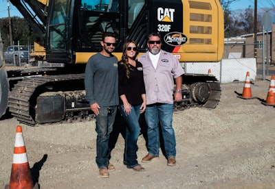 Corey and Samantha Watt, owners of McKinney Construction with Mike McKinney, former owner