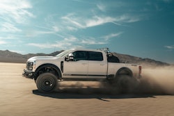 Shelby 2023 F-250 Super Baja side view driving in desert