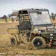 Landmaster AMP utility vehicle driving through mud