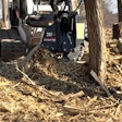 Stumper stump grinding attachment on a compact track loader