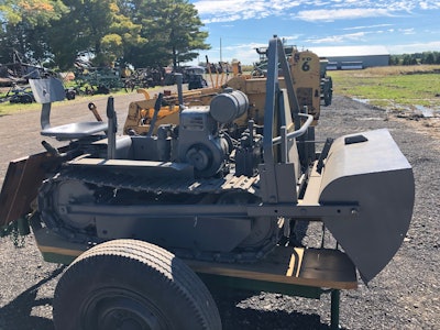 gray 1951 Mead Mighty Mouse dozer on two wheel trailer at HCEA 2022 convention