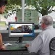 Two fleet employees at computer monitoring dashcam footage