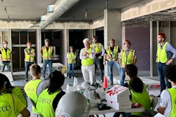 Clayco employees gather for a jobsite meeting