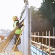 Construction worker building a concrete wall
