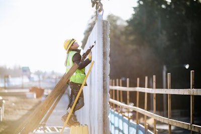 Construction worker building a concrete wall