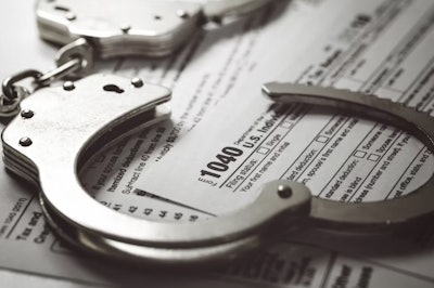 Form 1040 with handcuffs