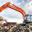 Hitachi zx300lc-7 excavator loading a crusher