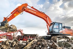 Hitachi zx300lc-7 excavator loading a crusher