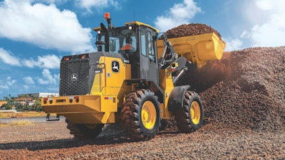 John Deere 444 G-Tier wheel loader at a pile