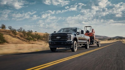 Ford F-Series Super Duty hauling a mini excavator