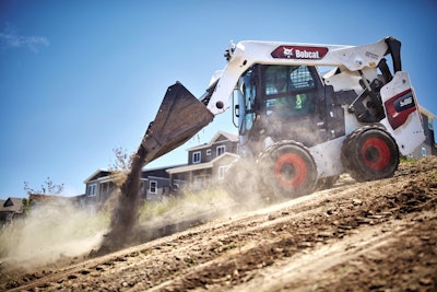 Bobcat S86 skid steer dumping dirt