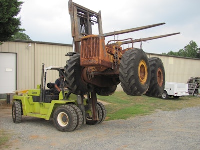 rusted 1962 Cat DW6 picked up by forklift