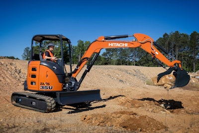 Hitachi ZX35U-5N mini excavator picking up rock