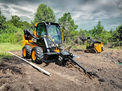 JCB 270 skid steer with trencher in dirt