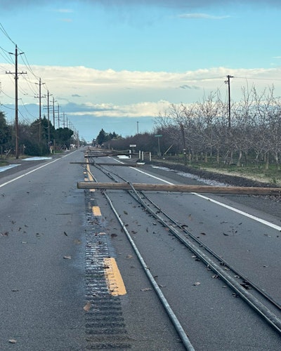 utility poles lie across SR 132 Modesto California