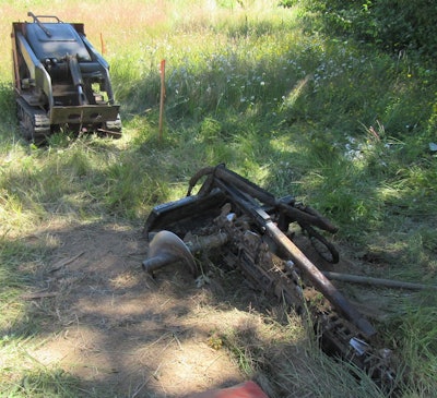 mini track loader with trencher attachment disconnected