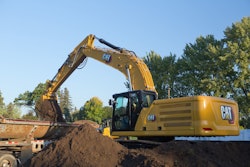 Cat 340 Excavator loading a truck