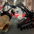 KRT ST 900 HD Mini track loader lifting a log