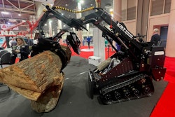 KRT ST 900 HD Mini track loader lifting a log