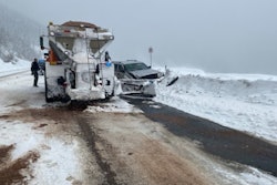 silver jeep cherokee crashed into snow bank beside snowplow