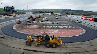 Sonoma Raceway repaving machinery on curve in track