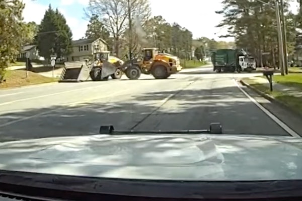 gwinnet police dash cam video of volvo wheel loader pushing side of volvo wheel loader in police chase