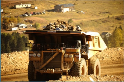 hauling truck coming up road