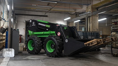 Firstgreen Rockeat all-electric skid steer carrying pallet