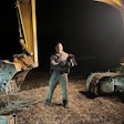 ECO Jarecki holds a bear cub rescued from an excavator cab