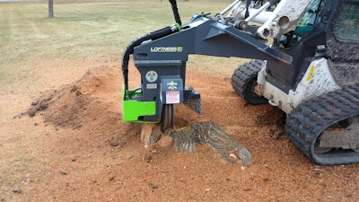 Loftness 24SG stump ax on compact track loader removing stump