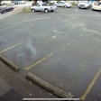 Loose saw blade barreling across a parking lot