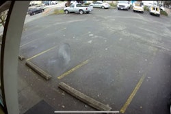Loose saw blade barreling across a parking lot